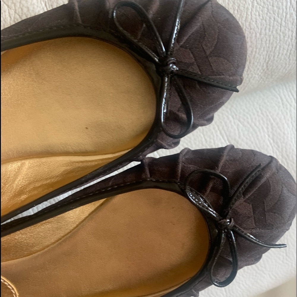 COACH Brown Flats Size 8.5 B. Leather sole.Coach Logo on the side of heel.